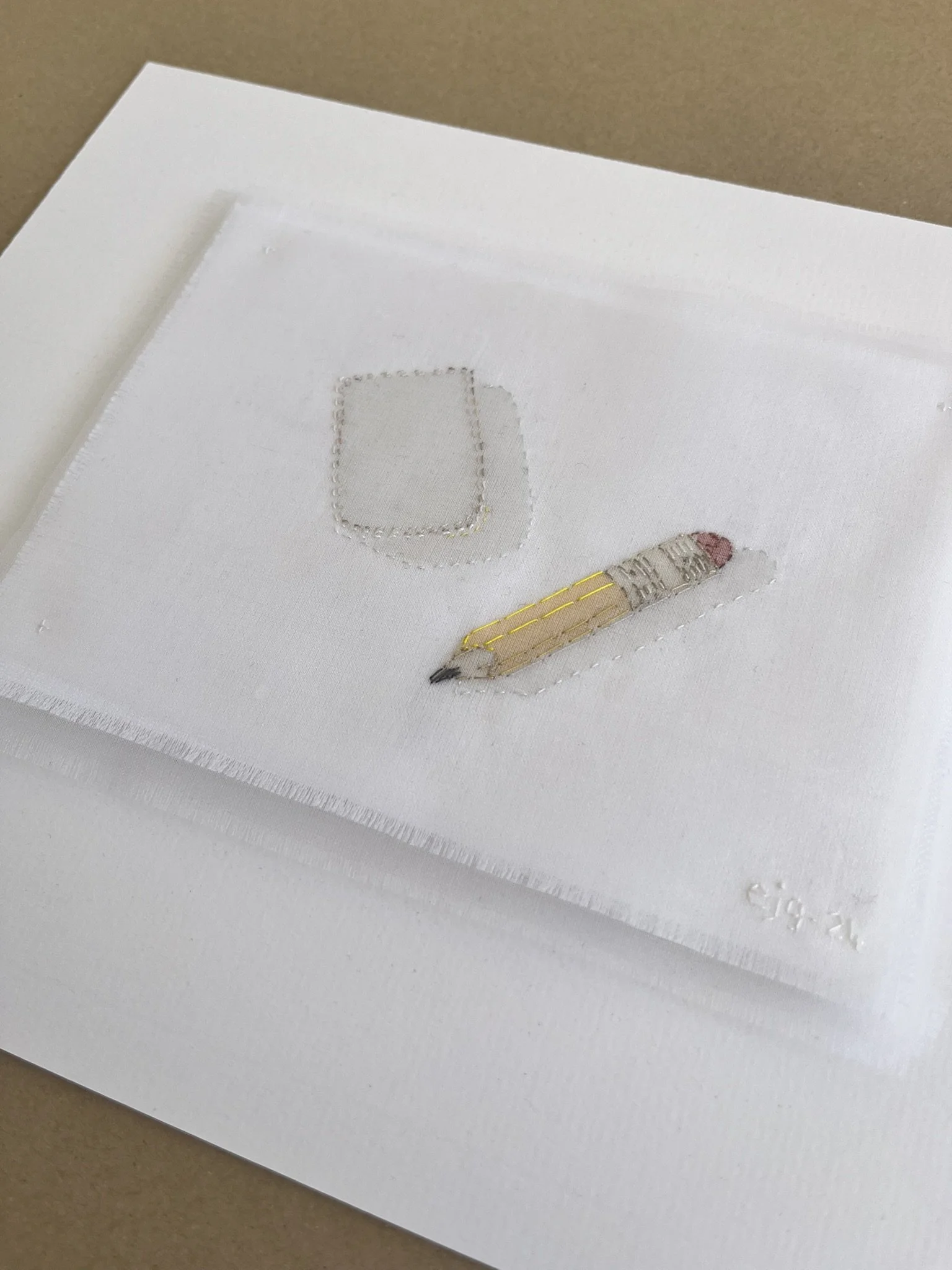 Yellow pencil, white rubber