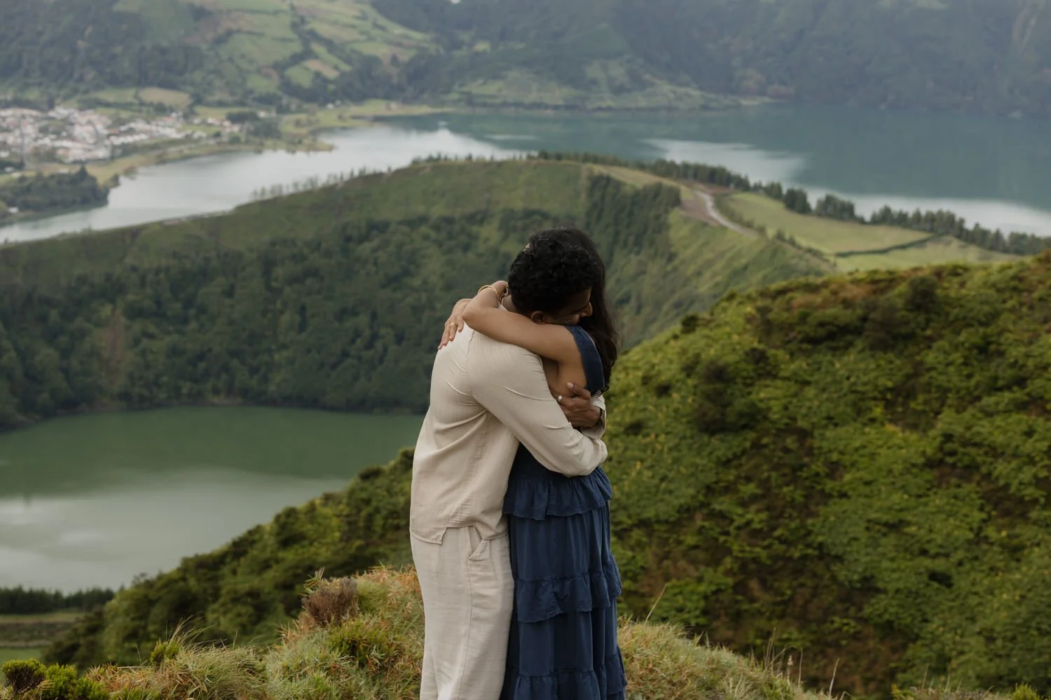 emotional embrace after a proposal with Sete Cidades lakes in the background Azores