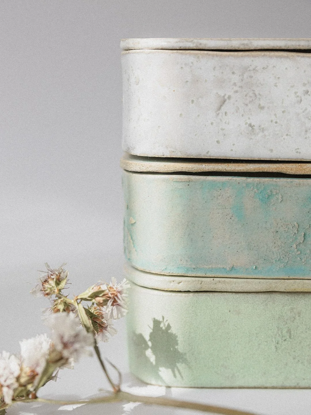 Three years ago, while working with ceramics, an idea began to take shape.

I imagined something more personal, organic and shaped by hand.

Today, the first three pieces are finally complete.
Each box was individually shaped, glazed and finished by 