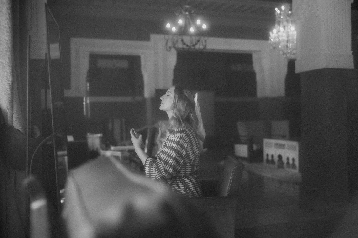 Bride getting ready at Beldi Country Club, captured in soft black-and-white light during her Marrakech destination wedding.