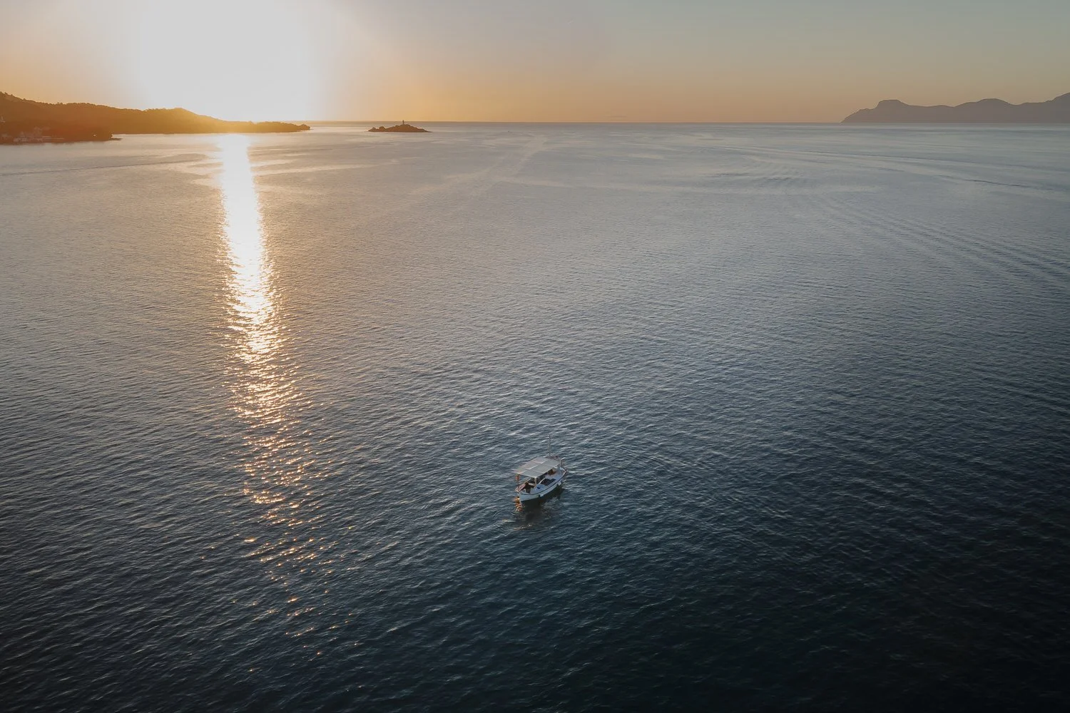 Sunrise boat ride on the Mediterranean during a two-day Mallorca elopement.