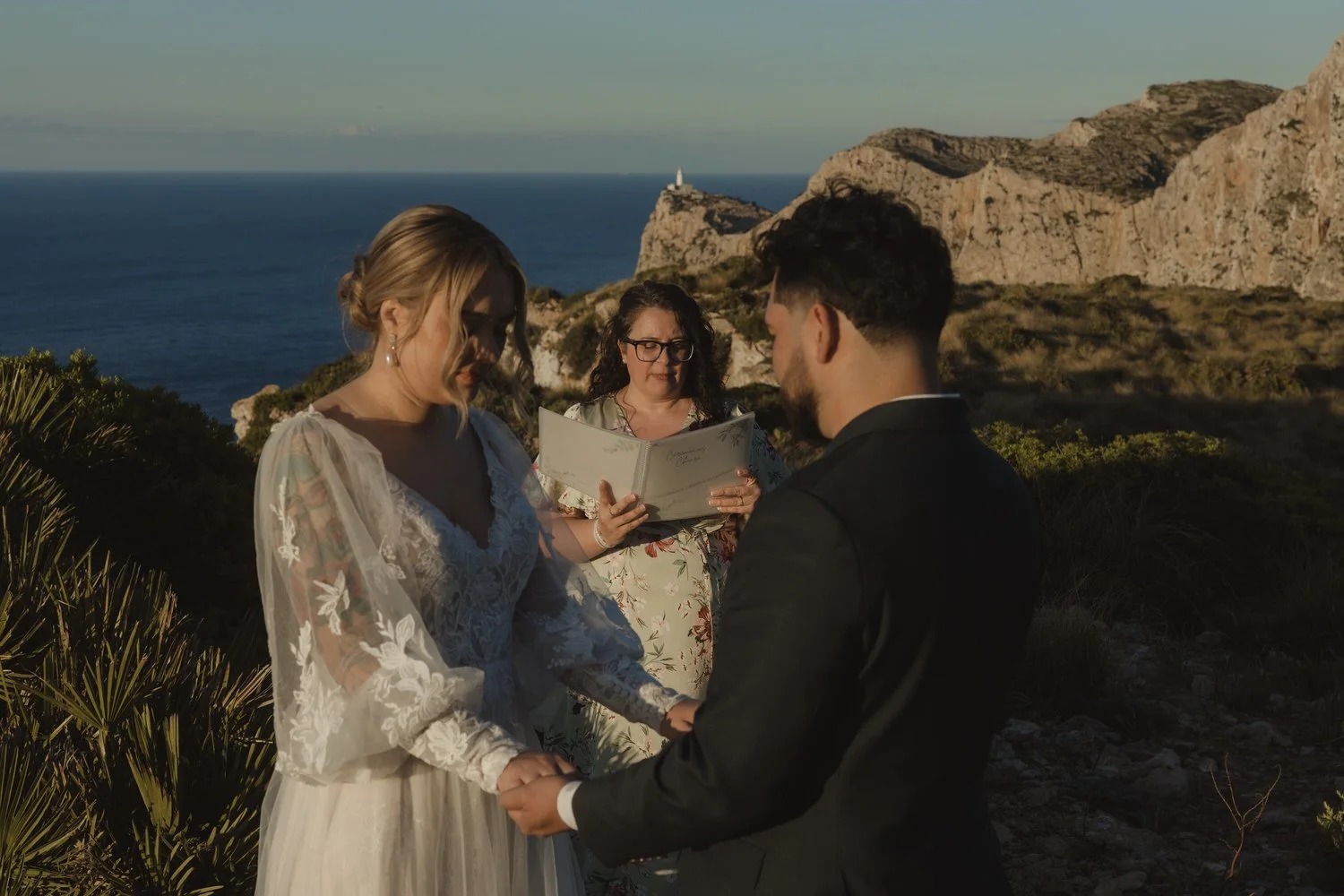 Couple exchanging vows during an intimate elopement ceremony at Cap de Formentor, Mallorca.