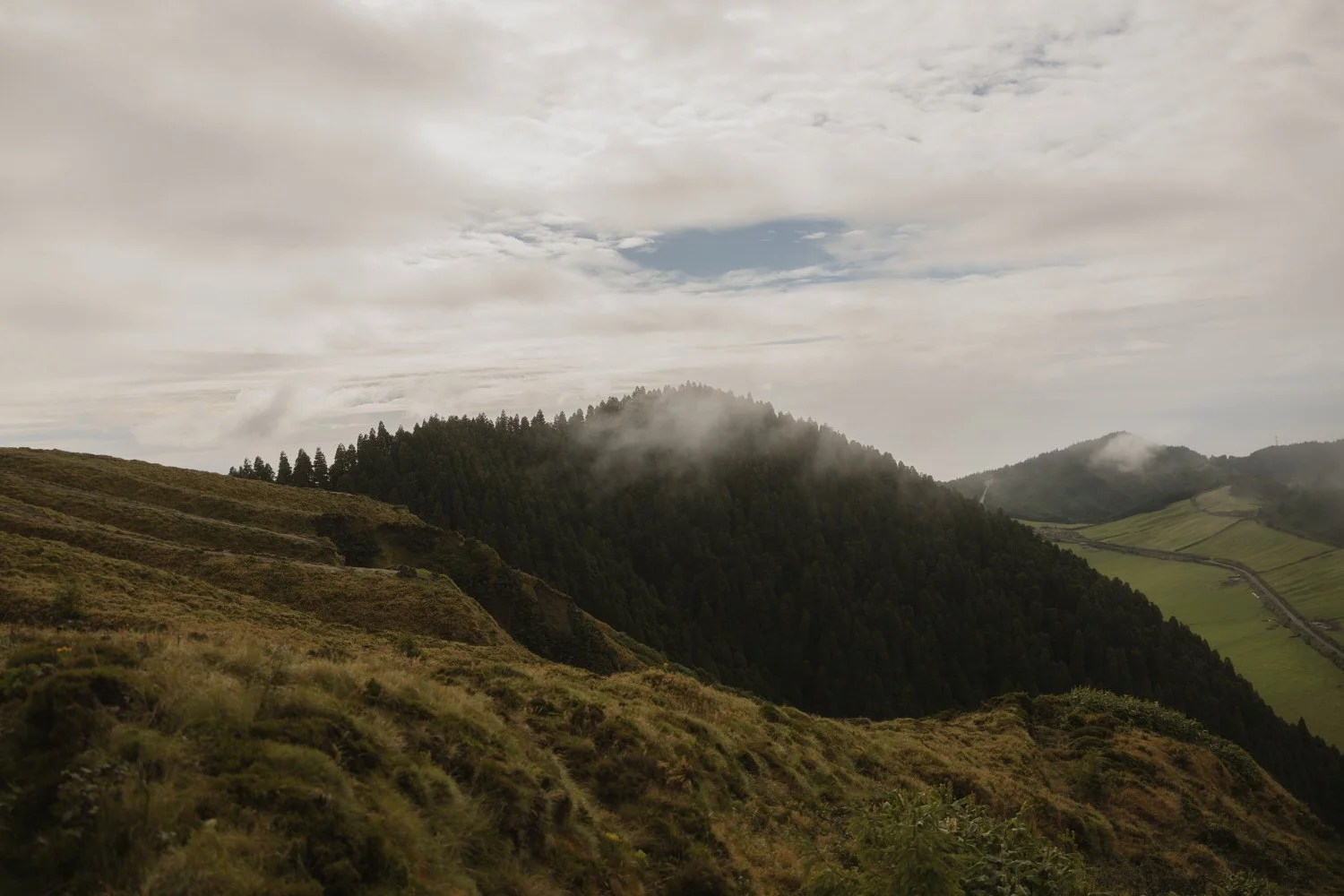 misty hills and forest landscape in São Miguel Azores before a surprise proposal
