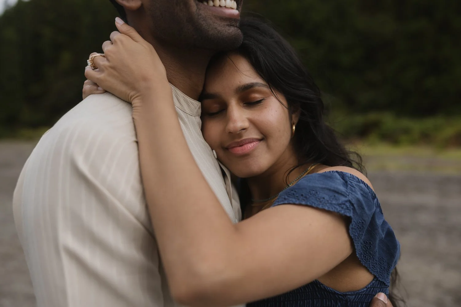 Bride hugging fiancé showing engagement ring during Azores proposal session