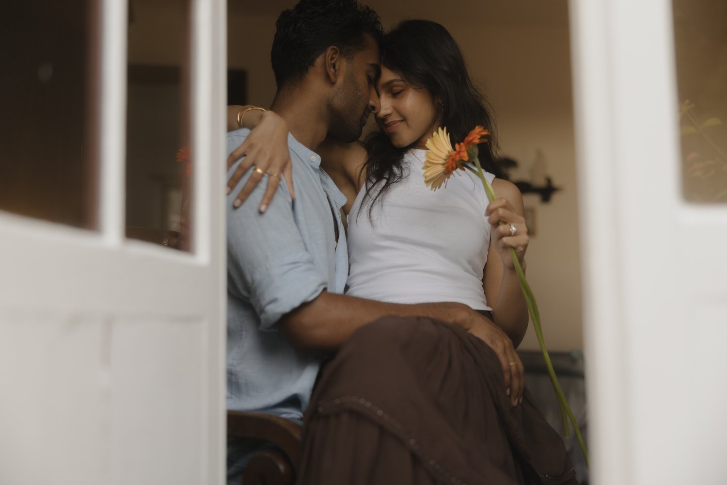 Manoj and Nimisha sharing a quiet moment together inside their accommodation in São Miguel, Azores after their proposal