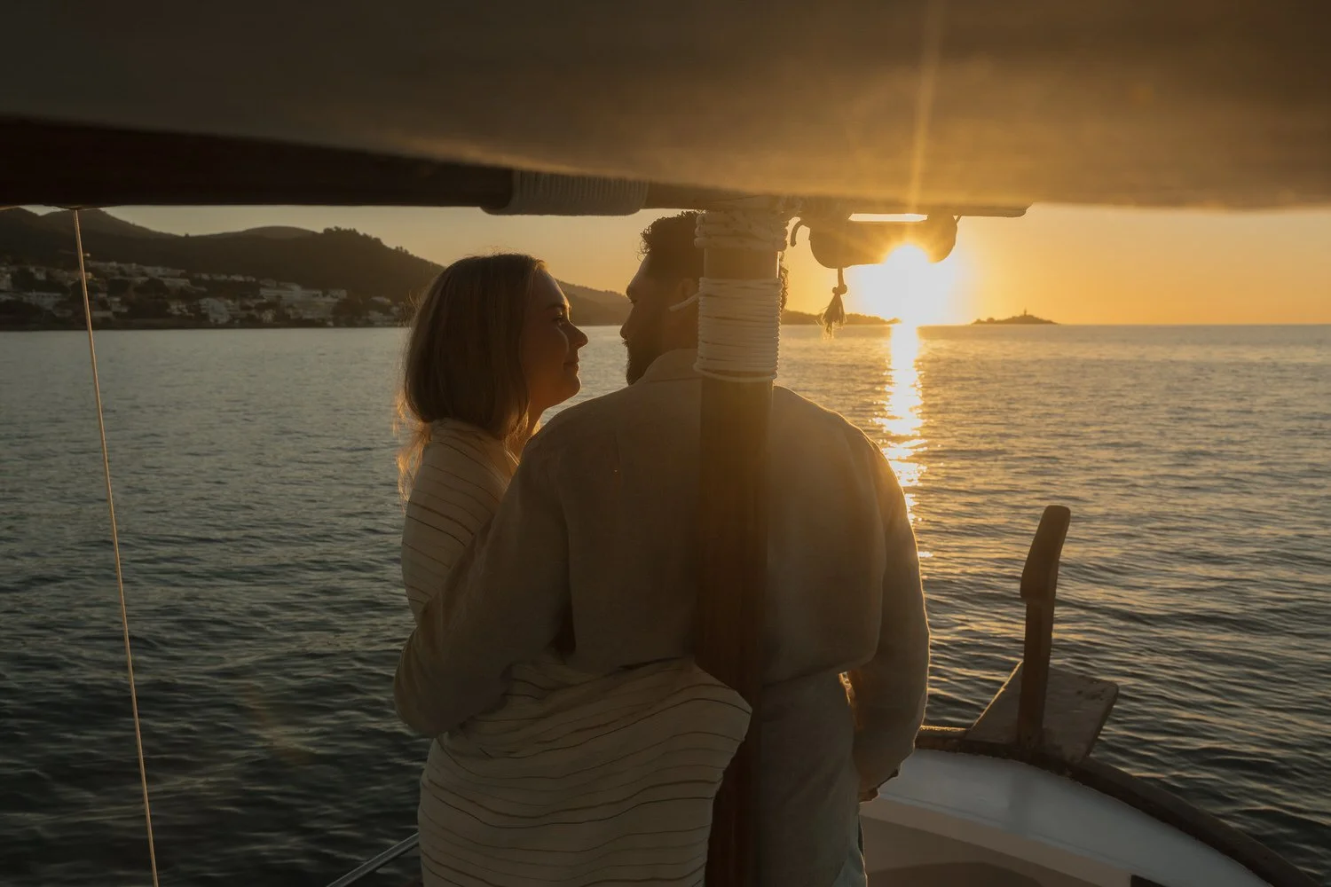 Couple enjoying a sunrise boat trip in Mallorca before their elopement ceremony.