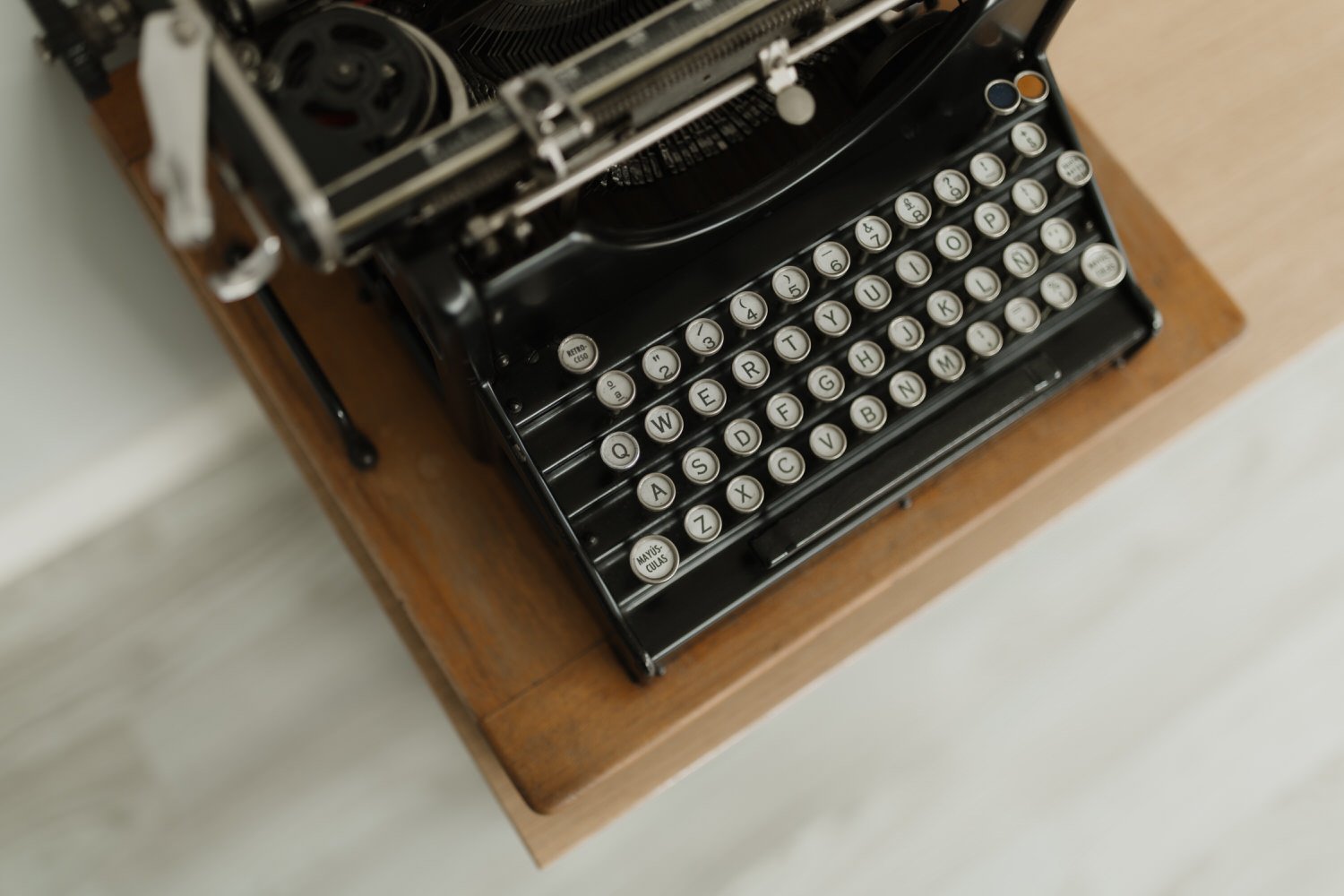 Minimal detail of a vintage typewriter during quiet wedding preparations