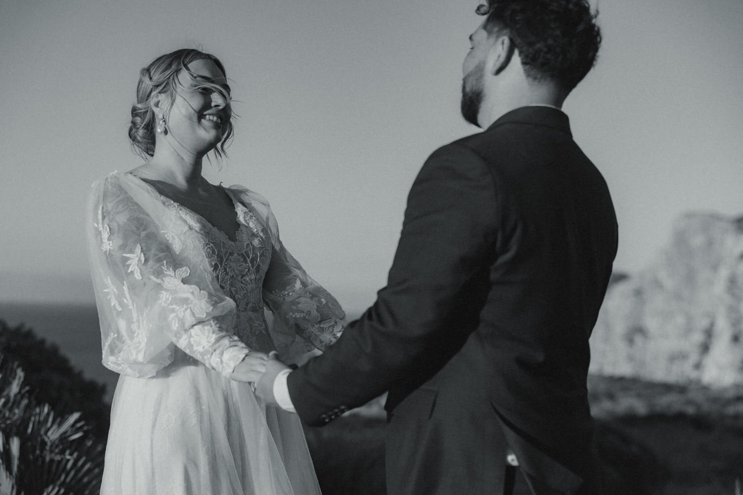 Bride and groom smiling during their intimate elopement ceremony at Cap de Formentor, one of the most iconic elopement locations in Mallorca.