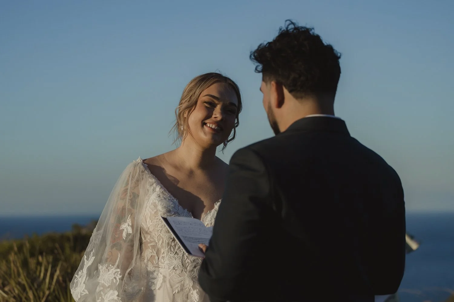 Bride listening to personal vows during an intimate Mallorca elopement ceremony