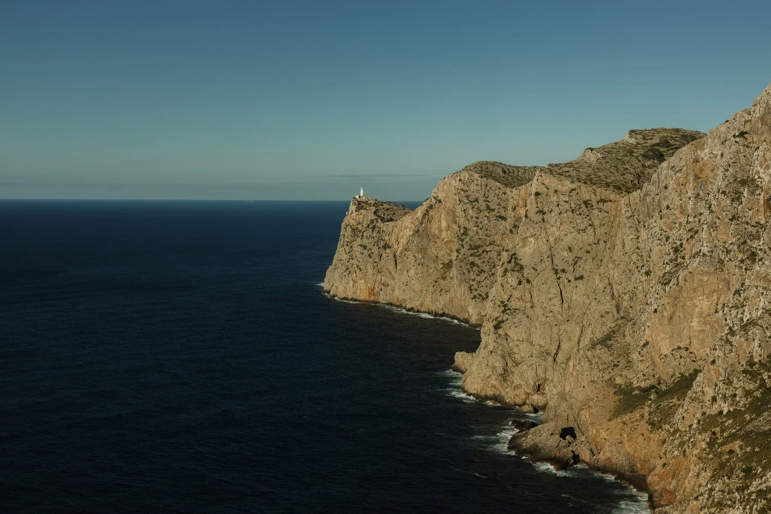 Panoramic view of Cap de Formentor lighthouse and the dramatic cliffs of northern Mallorca during a two-day elopement.