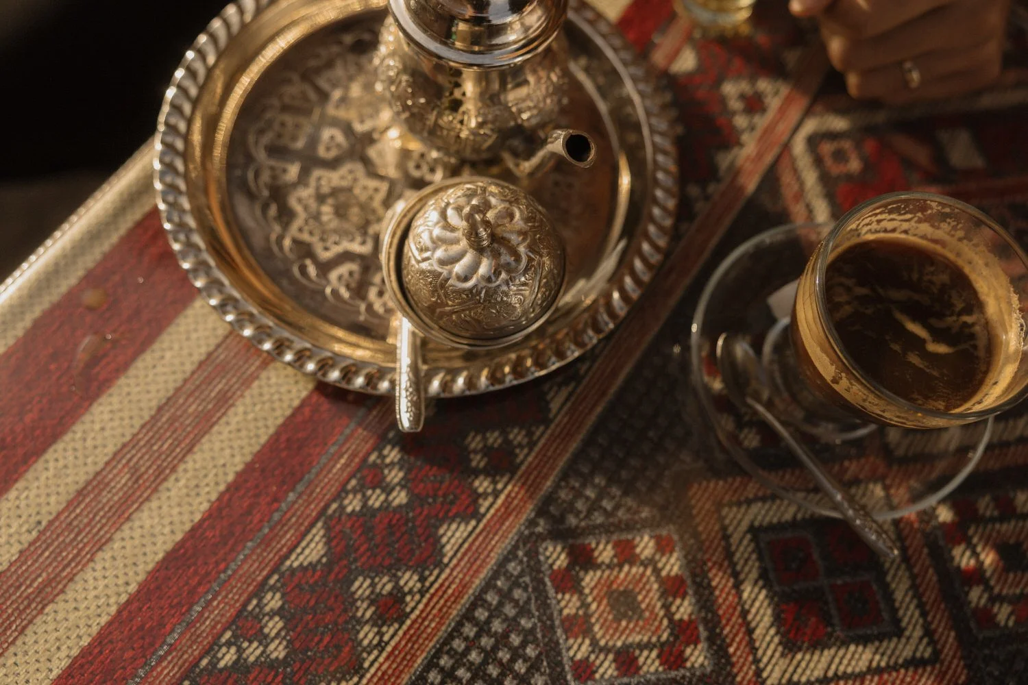 raditional Moroccan tea set on patterned table in Marrakech, captured during the days leading up to a Beldi Country Club wedding.