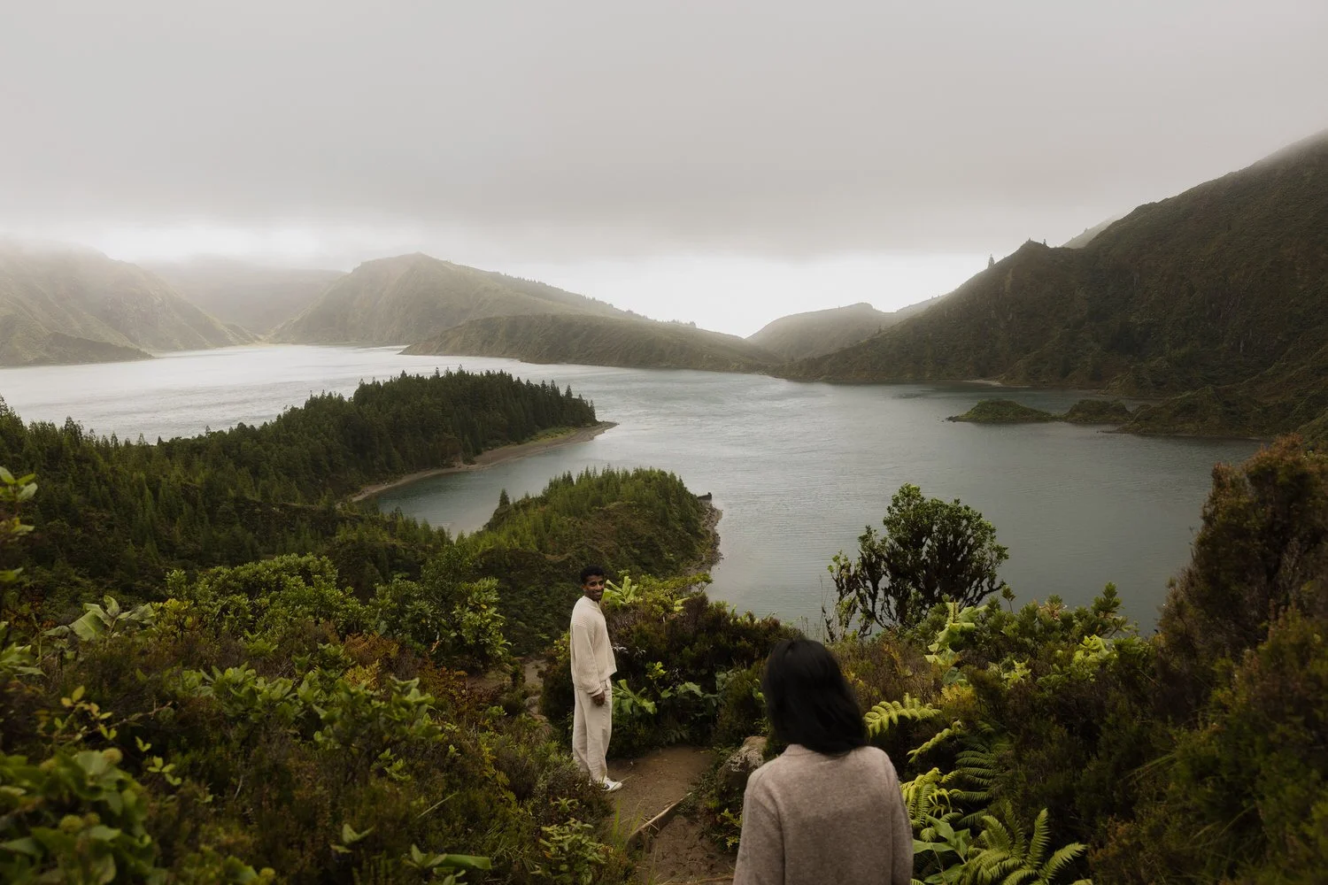 Manoj and Nimisha exploring a volcanic lake landscape in São Miguel, Azores