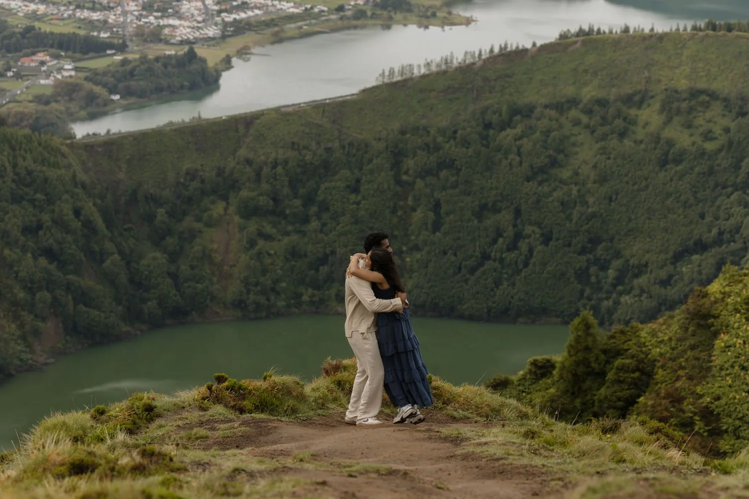 couple hugging after a marriage proposal overlooking the lakes of Sete Cidades Azores