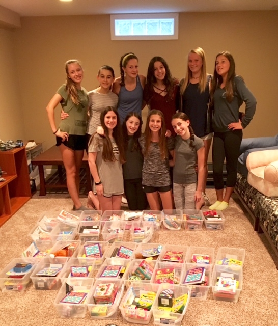 Zoe and friends assembling Jared Boxes for their peers at Children’s Hospital.