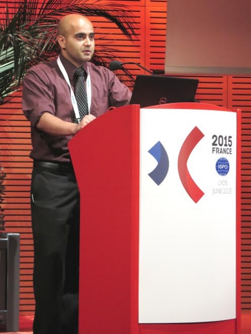 Ali Hussaini presenting at an ISPO conference in France. 