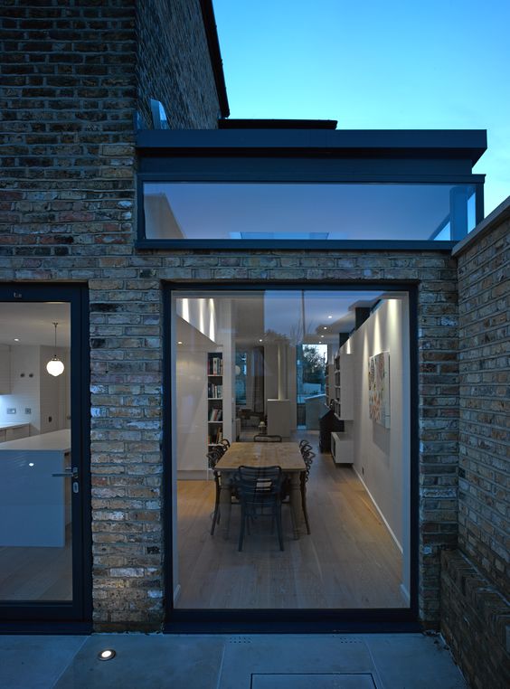 Bi Folding doors have taken a back seat for black frame floor to ceiling window and door.