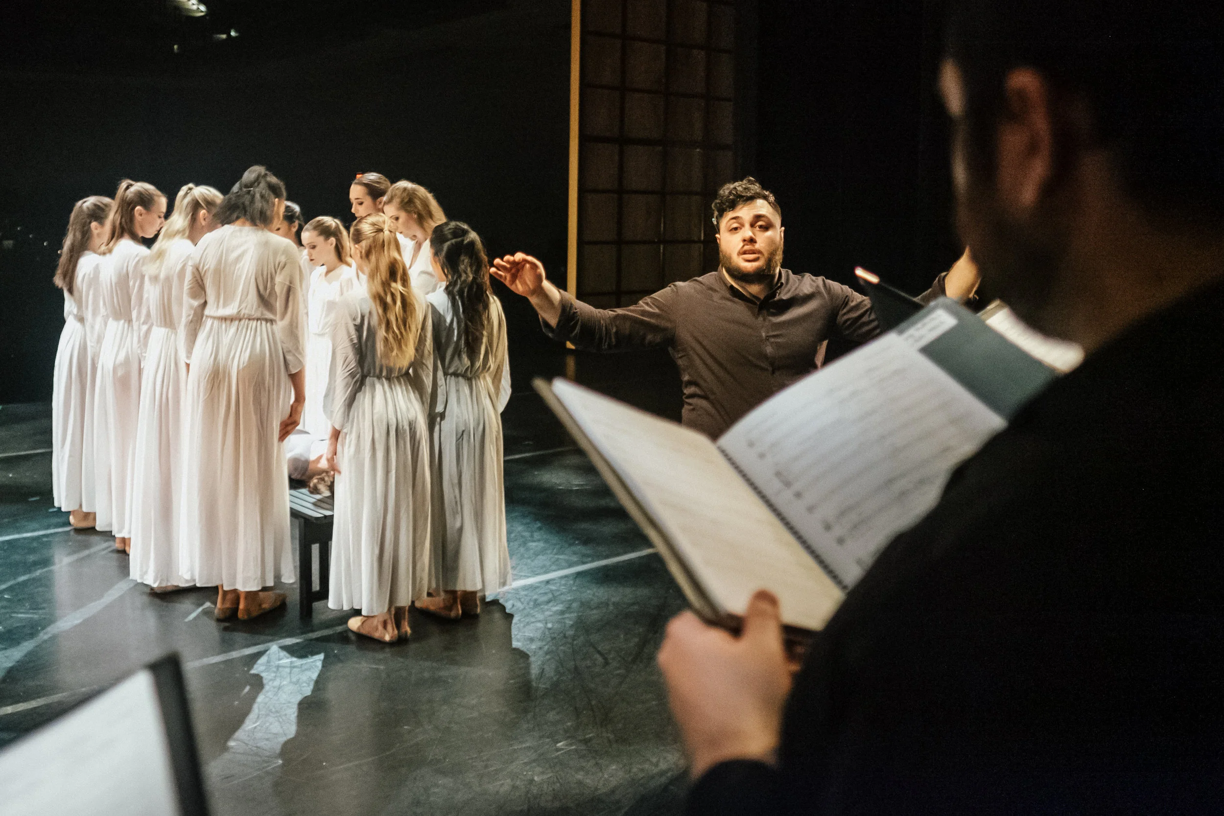 The dancers, now clad in white, place the corpse of the little match girl. Photo: Dickie Hill