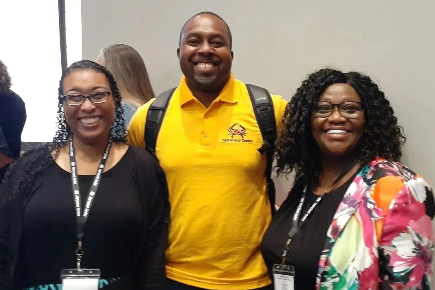 three smiling teachers