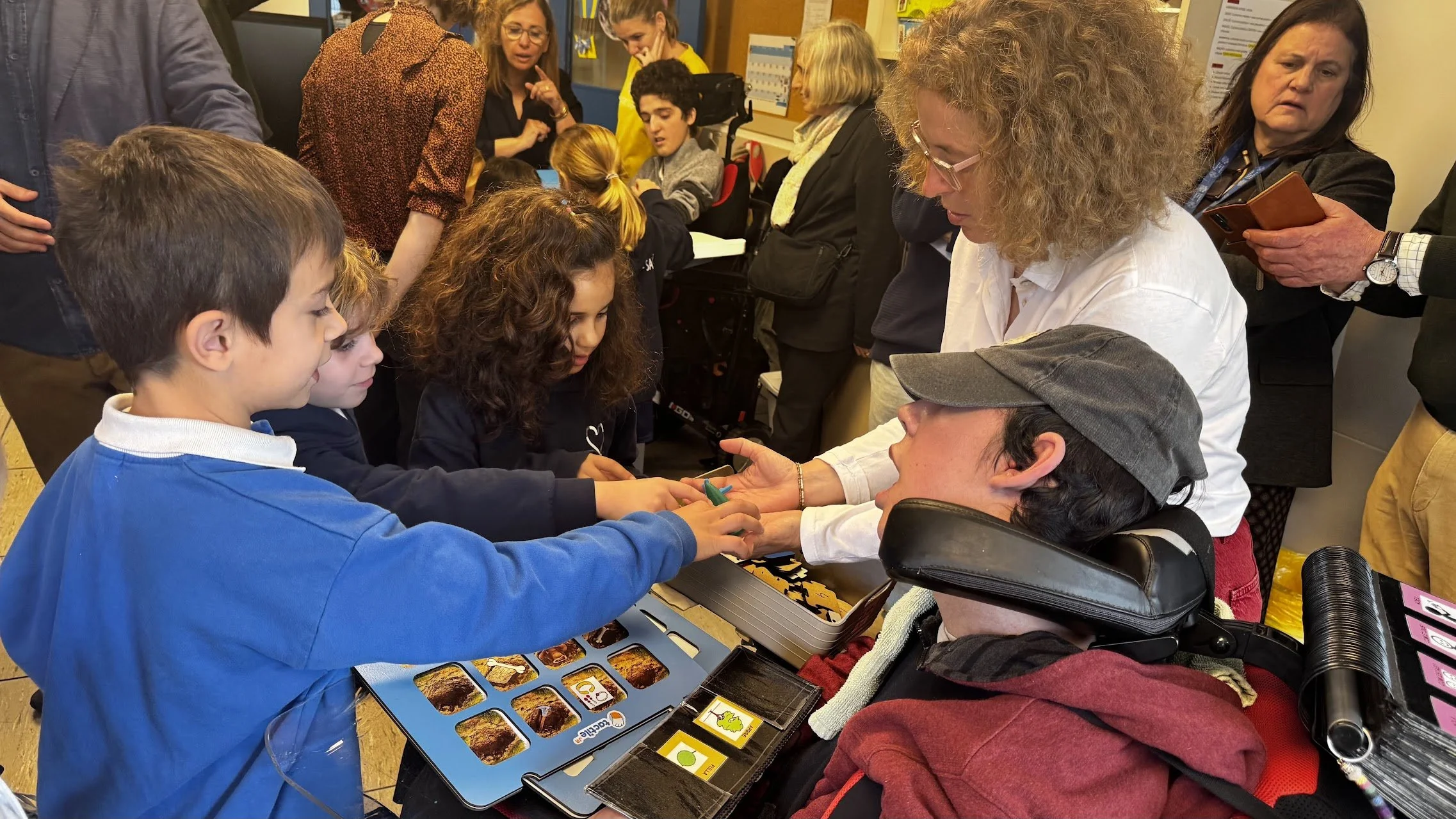 students and one adult using Scratch Tactile.
