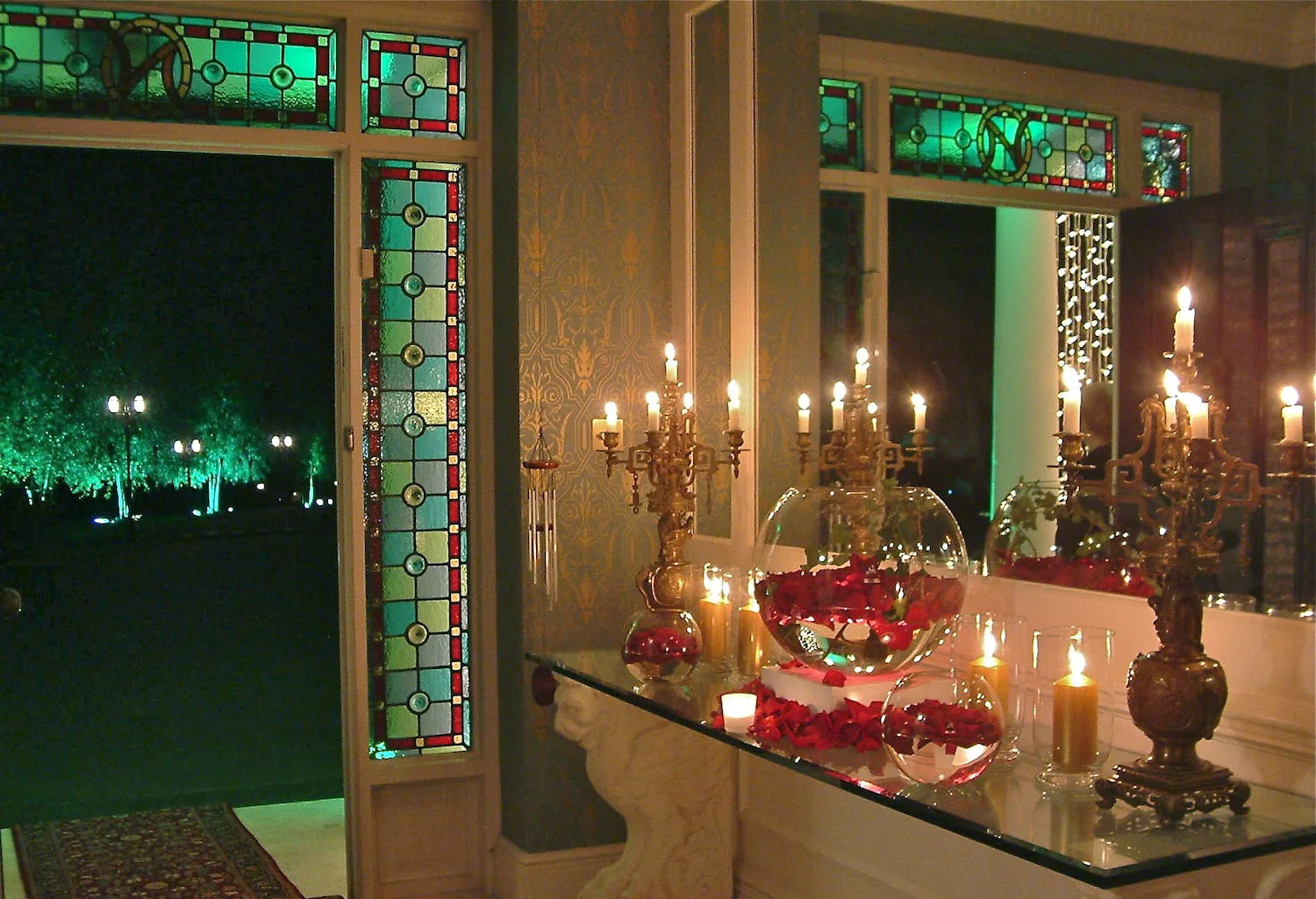  Diwali Entrance Display: Large globe bowl containing Grand Prix roses, with antique gold candelabras 