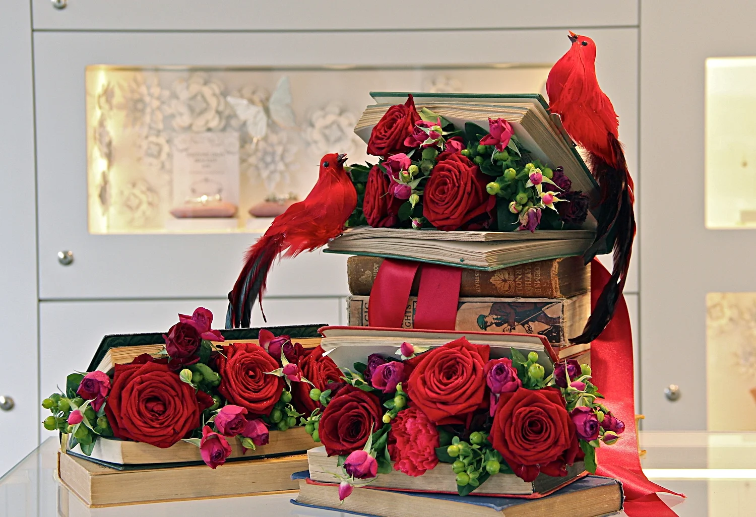  Pandora Kings Road: Chelsea in Bloom. Velvety red roses and feathered birds, set within vintage books. 
