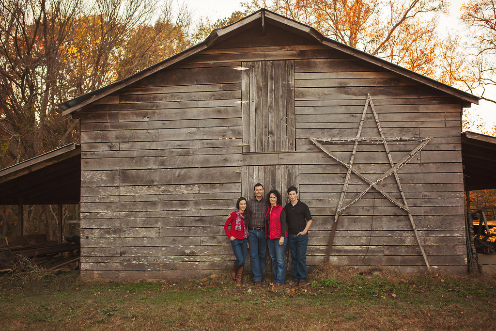  Candace photographs Pinehurst NC family in field with barn.&nbsp; 