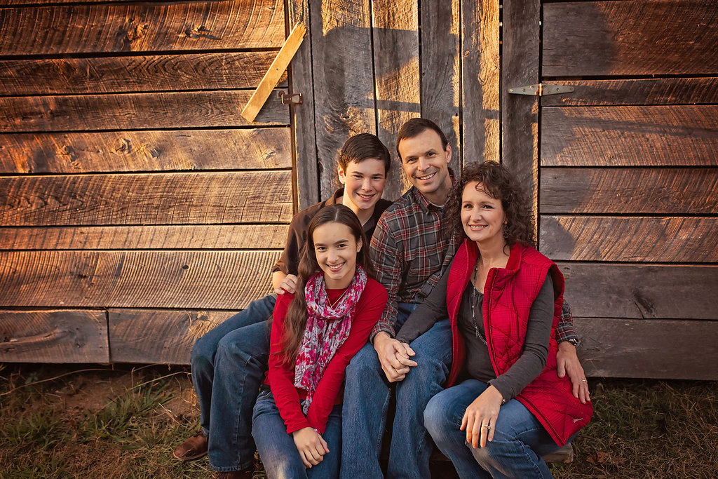 Pinehurst NC parents pose together with children for family portraits