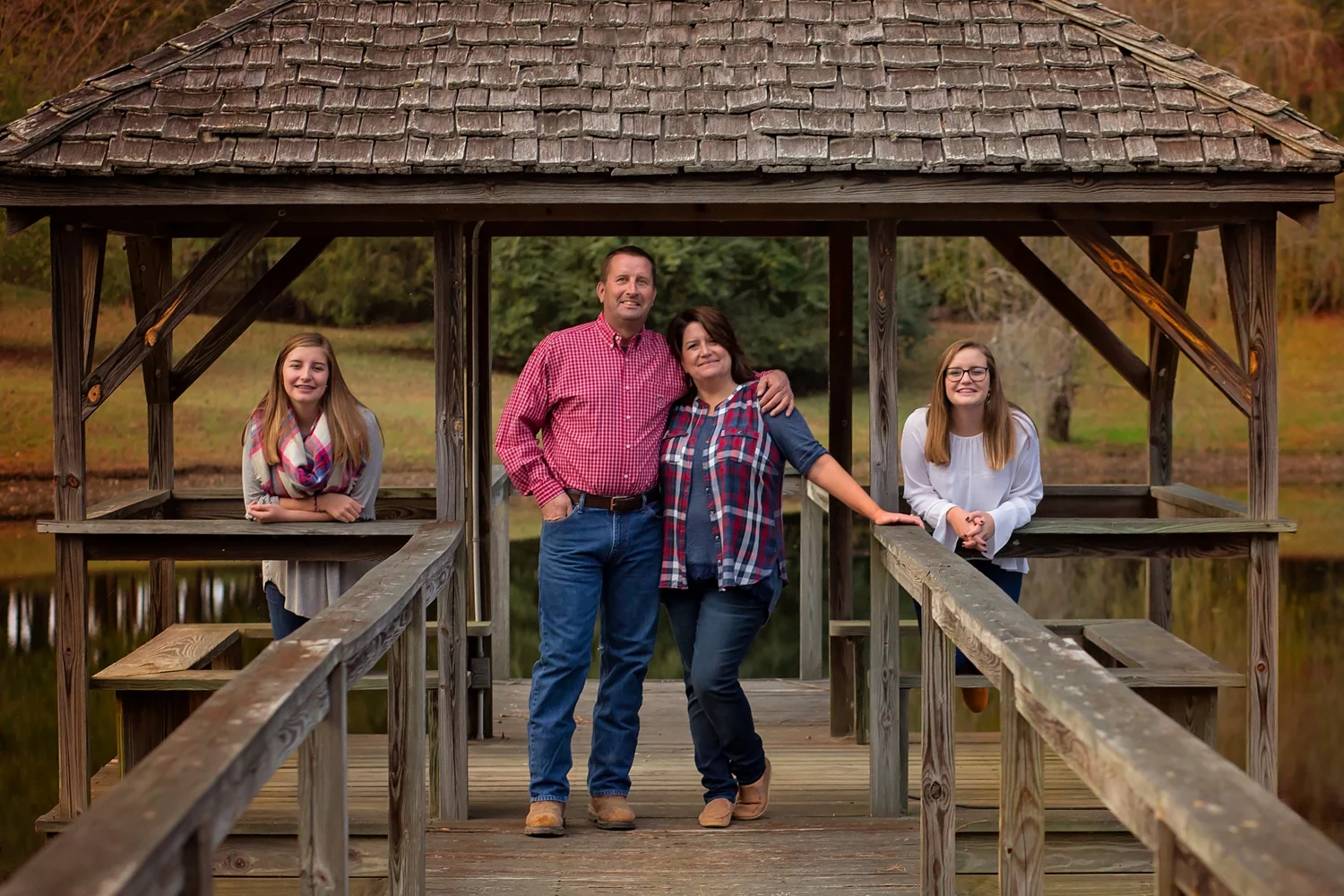 Fall photos on the dock with sisters and parents