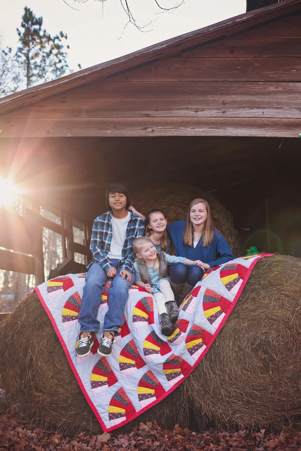 Siblings on Hay Bales and Family Quilt
