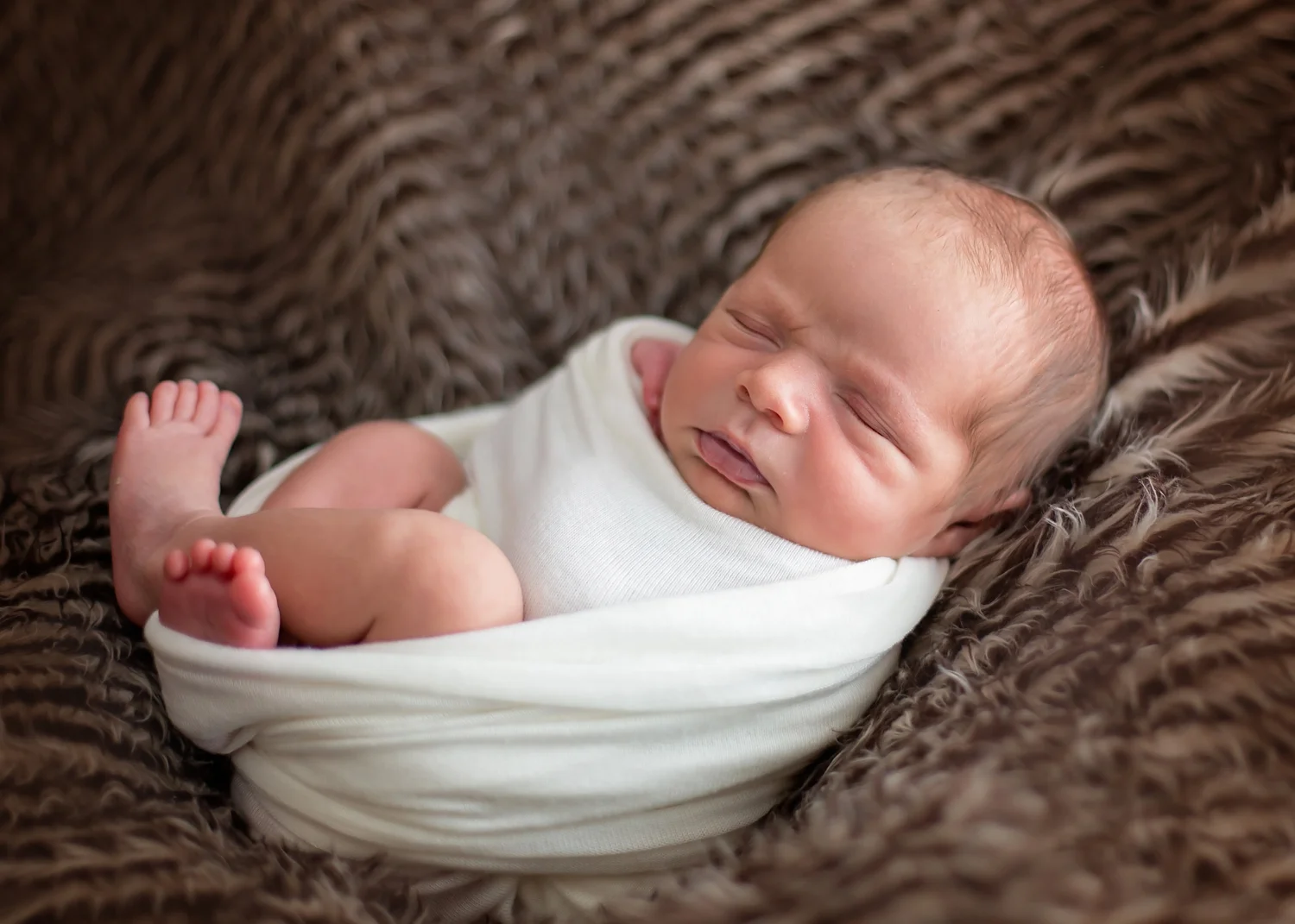 Newborn Baby wrapped up for photo session