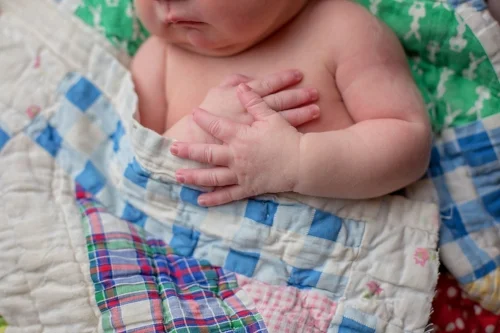 Raleigh NC newborn photographer captures hands of baby girl sleeping. 