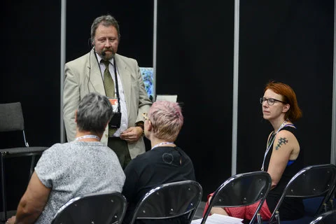 Dr. Jon Stamford presenting his book at the WPC 2016 Book Nook with Sara Riggare in the audience.