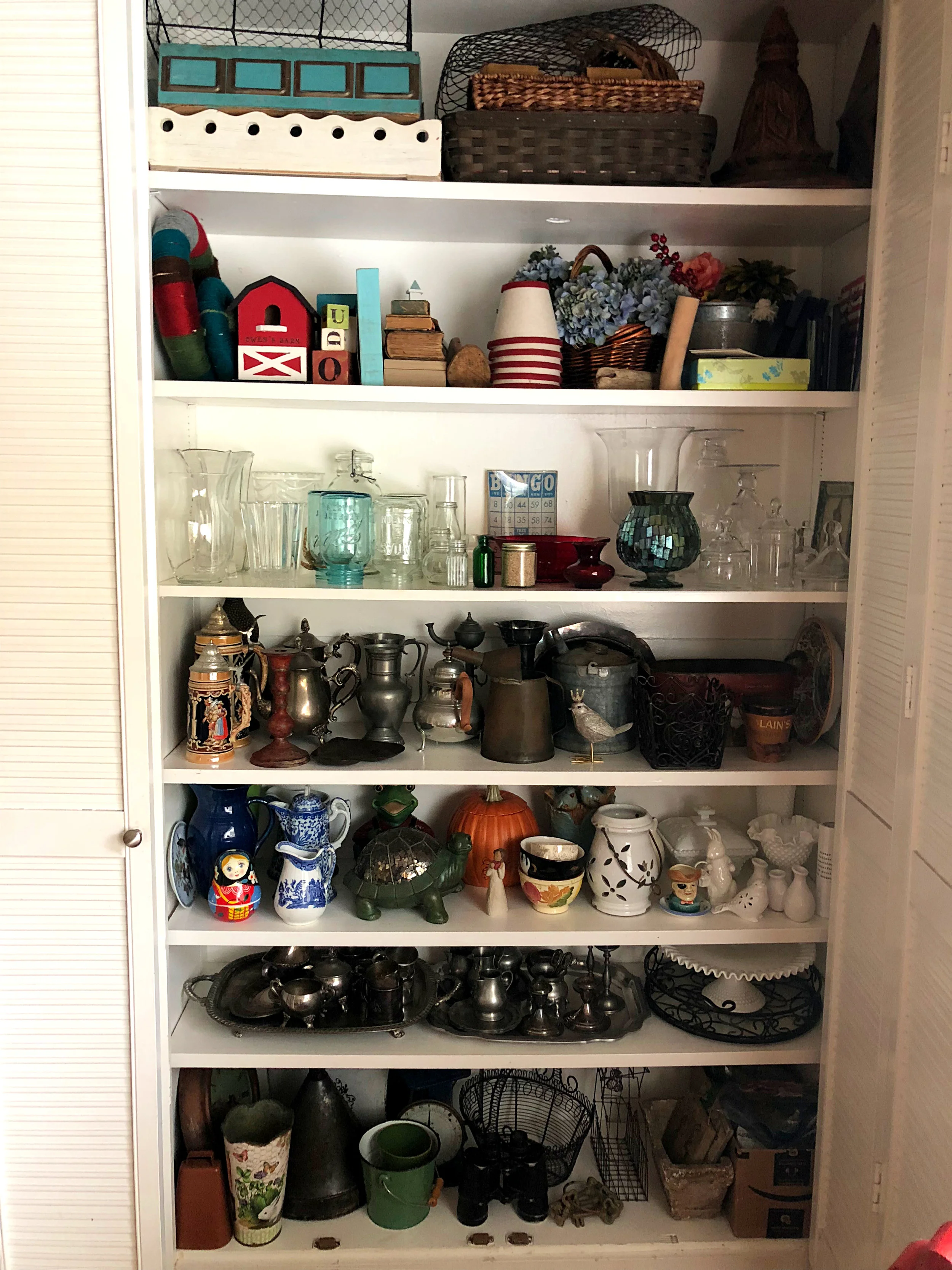 Before you head out to buy more stuff, check your stash of decor items. Taking the time to organize it by material (metal, ceramic, wood) will make choosing items easier.