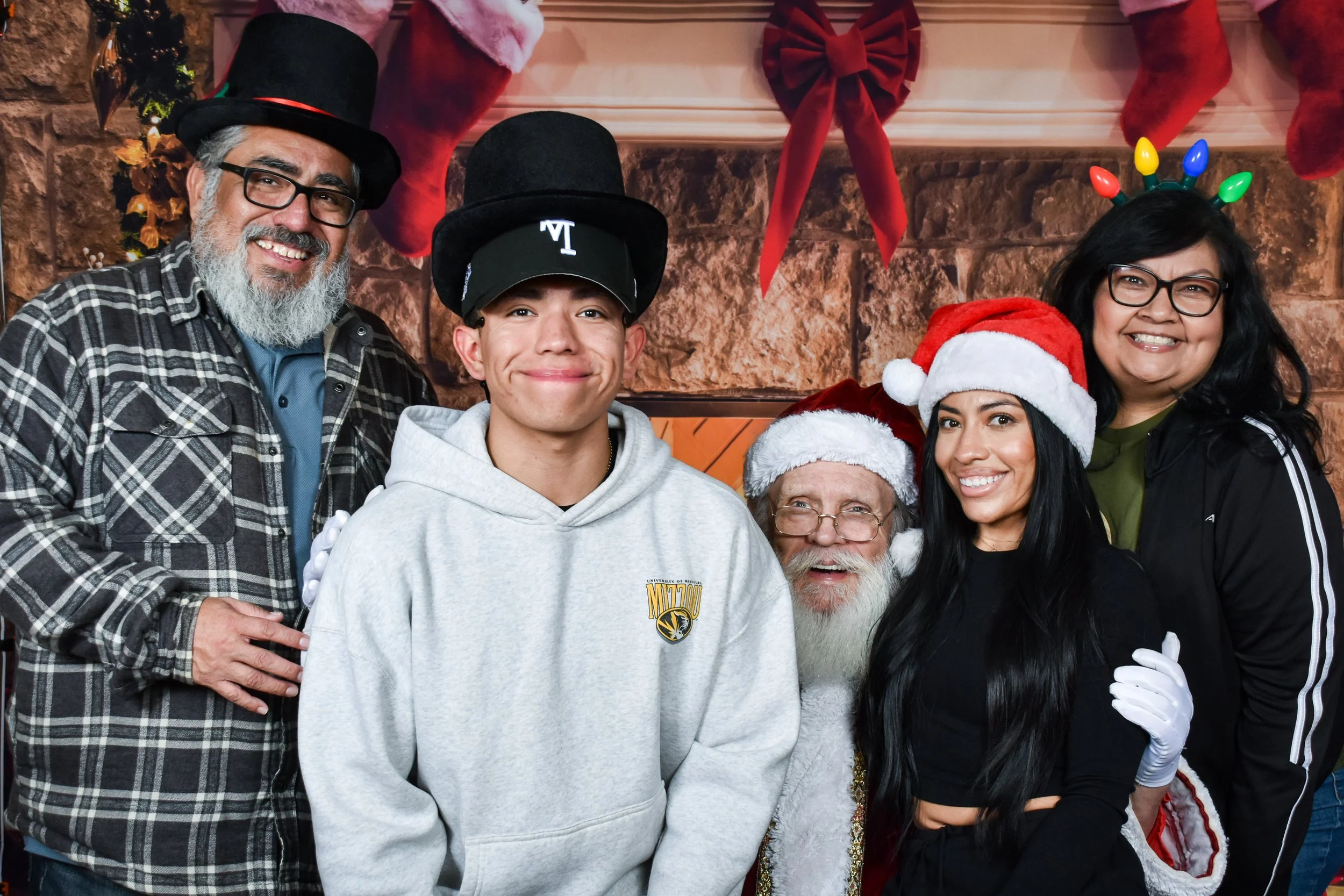 Team Remo Photos with Santa 2025 - Martinez Family 4.jpg