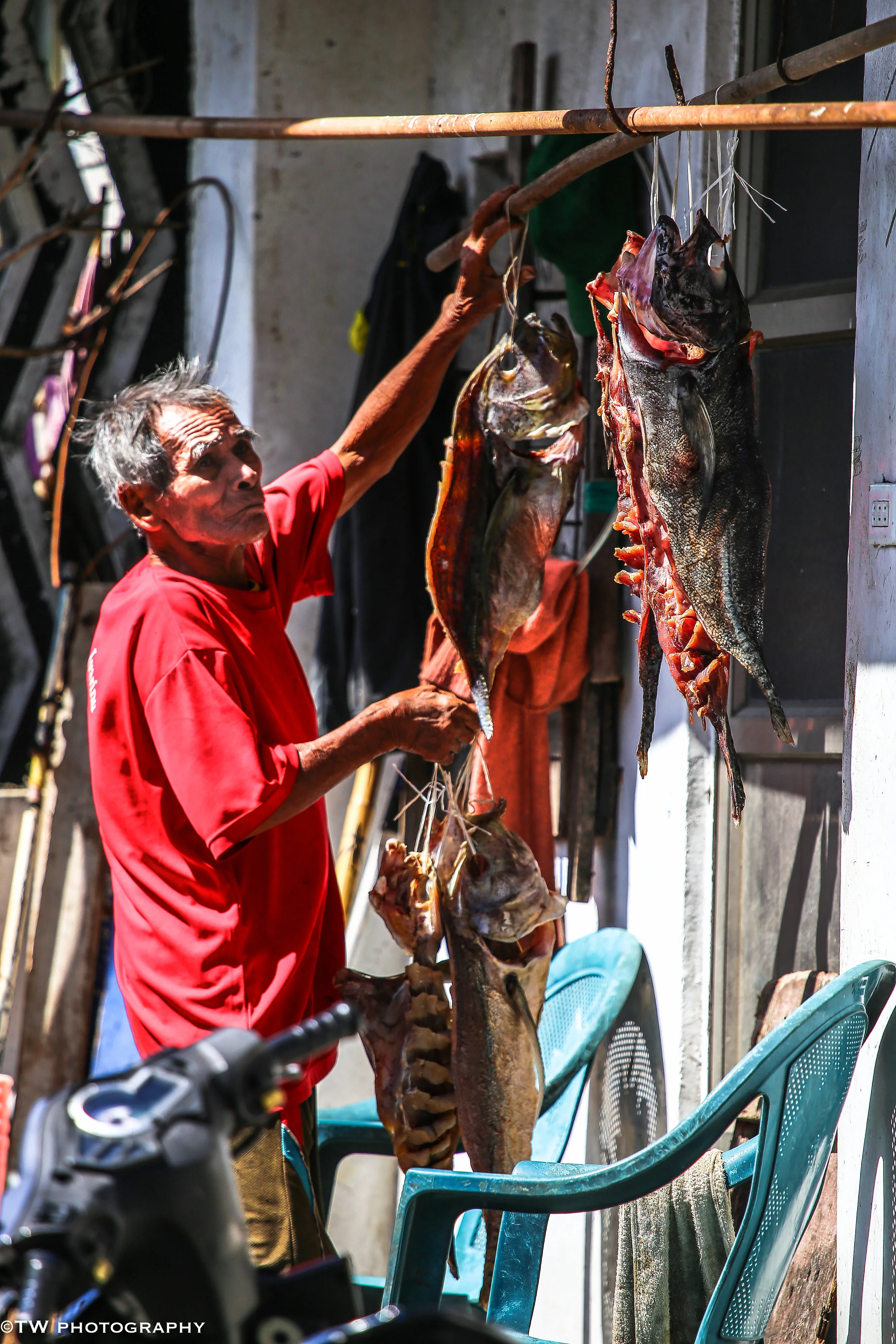 Native fisher hanging dried fish at Lanyu Island, Taiwan
