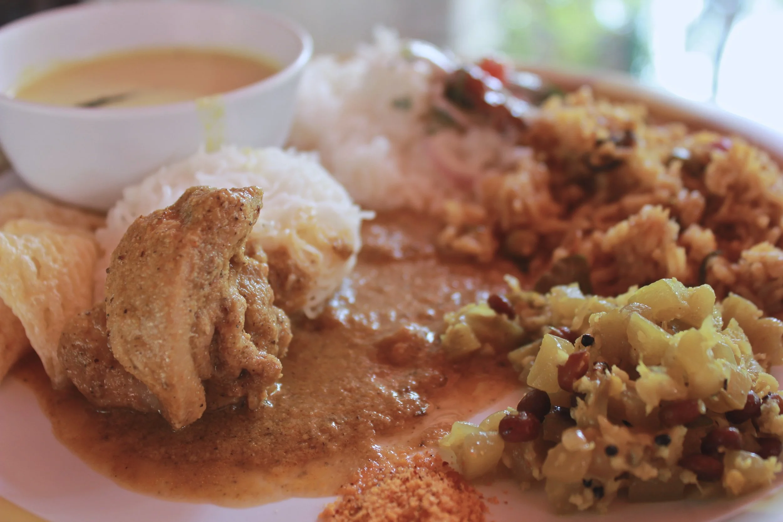 Chicken kuzhamba, poriyal, mor kuzhamba, idiyappam, biryani and raita for lunch - Karnataka food - Kannadiga food