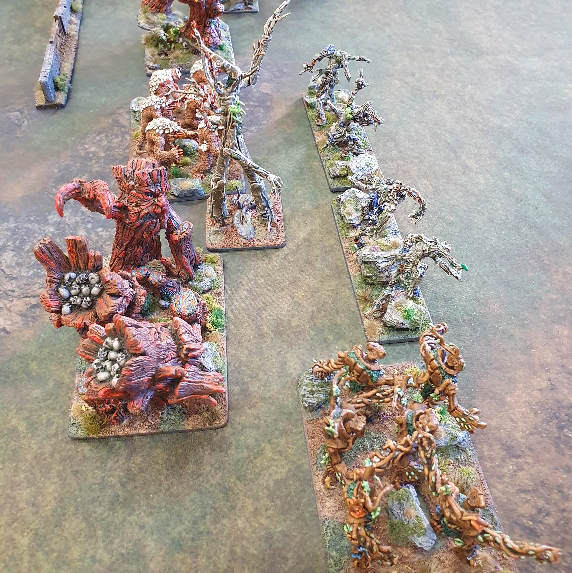  Kings of War treemen shamble toward their beastmen foe 