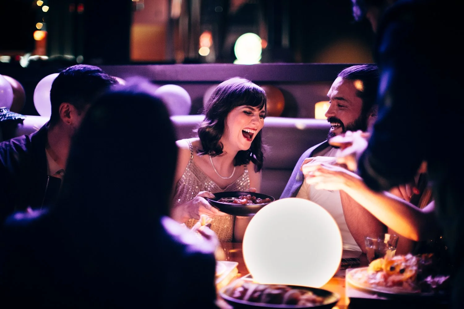Candid shot of happy friend enjoying dinner - Photos by Kateland