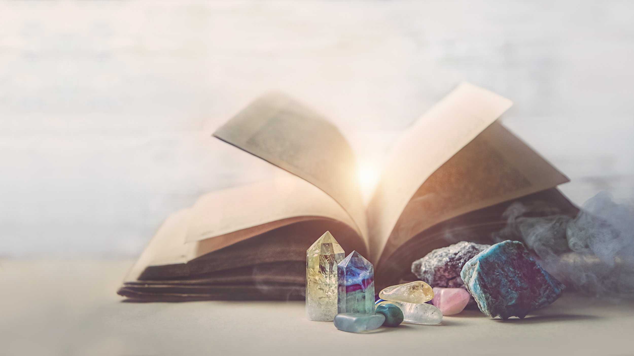 AA - mystical composition with minerals and crystals and ancient book.jpeg