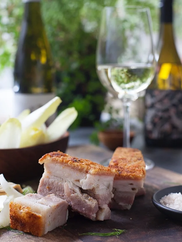 Crisp pork belly with fennel, witlof and white anchovy salad