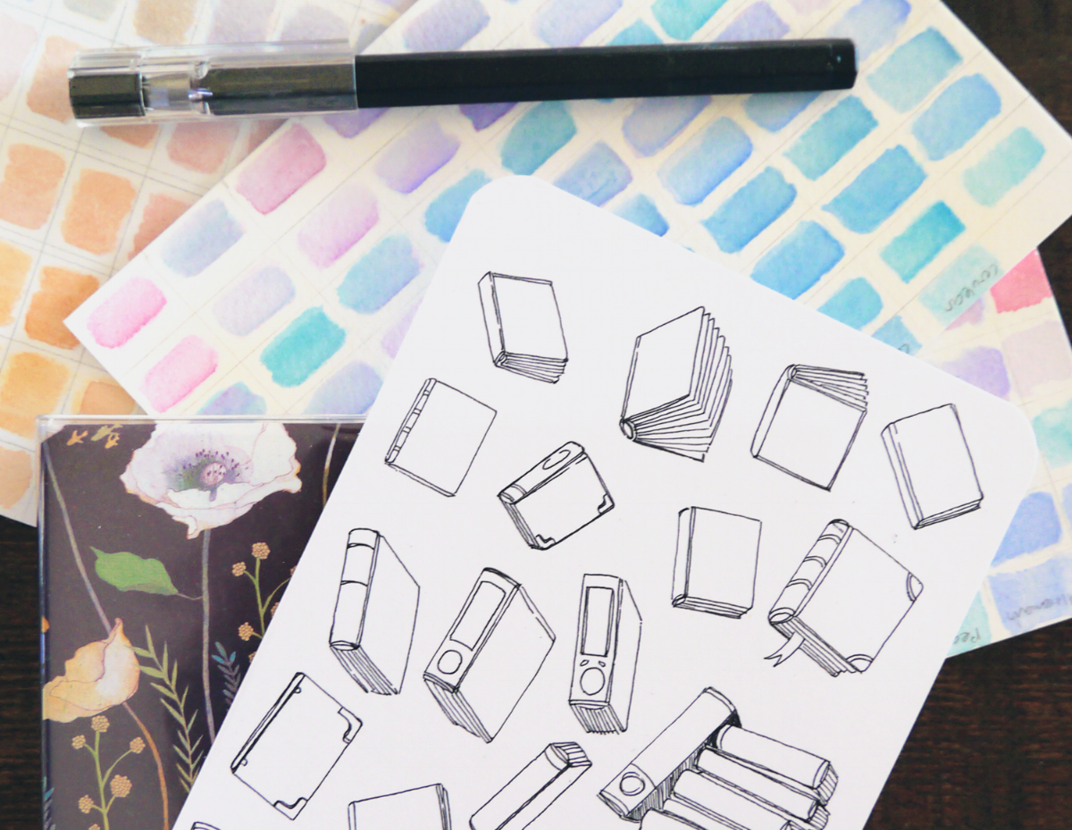 I also have a tendency to procrastinate by drawing random writing stuff... You can find a book coloring page printable at the end of this post!