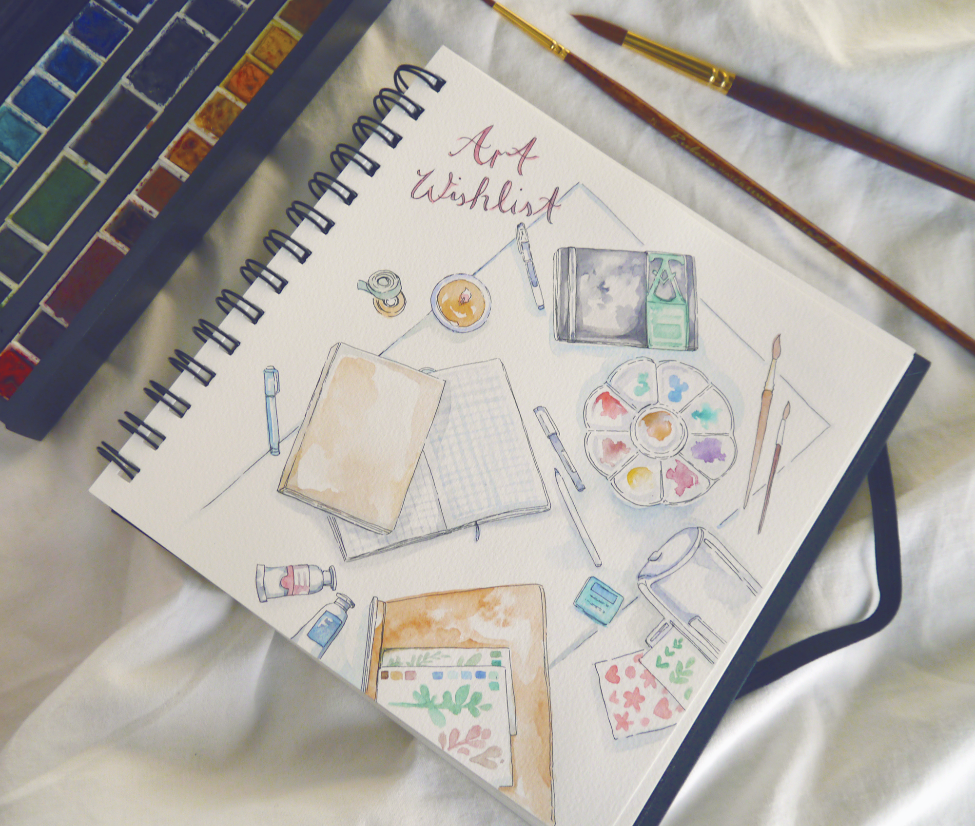My favorite art supplies and artist gift wishlist, illustrated in my sketchbook. Since the sketchbook in question is nearly full, I of course look forward to getting a new one soon - but I also recommend other favorite art materials, journals, notebooks, and paper for both professional and hobby artists.