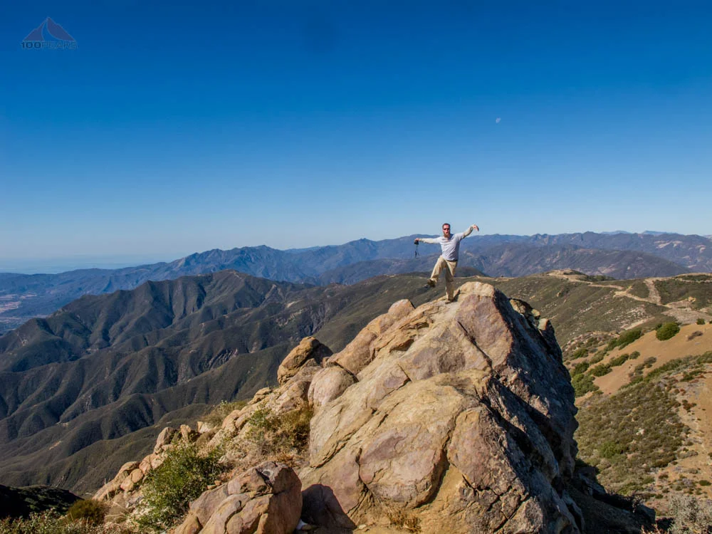 Craig, doing The Crane on top of Chief Peak