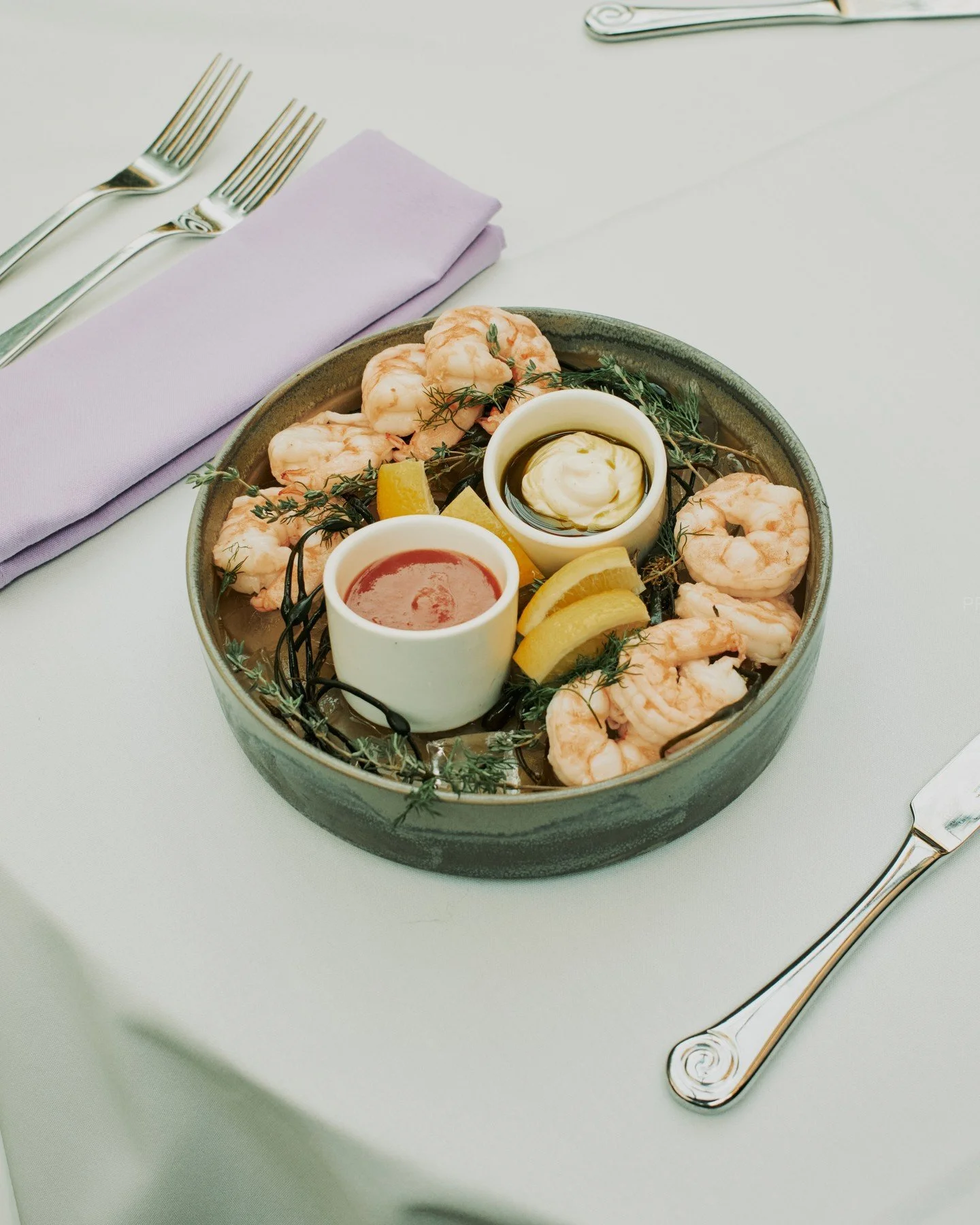 Smaller shrimp. Better flavor. Gently poached and served with classic cocktail sauce, fresh horseradish, organic ketchup, lime aioli with basil oil, and a little lemon to brighten it all up.🦐