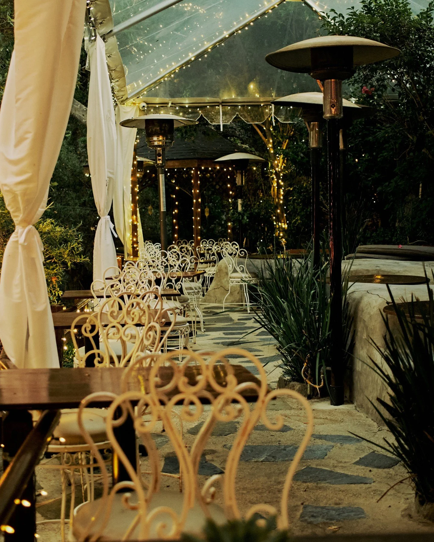 Every step on our terrace tells a story, hand-set stone, river rock carried in by hand, and a concrete path leading you into the canyon night.