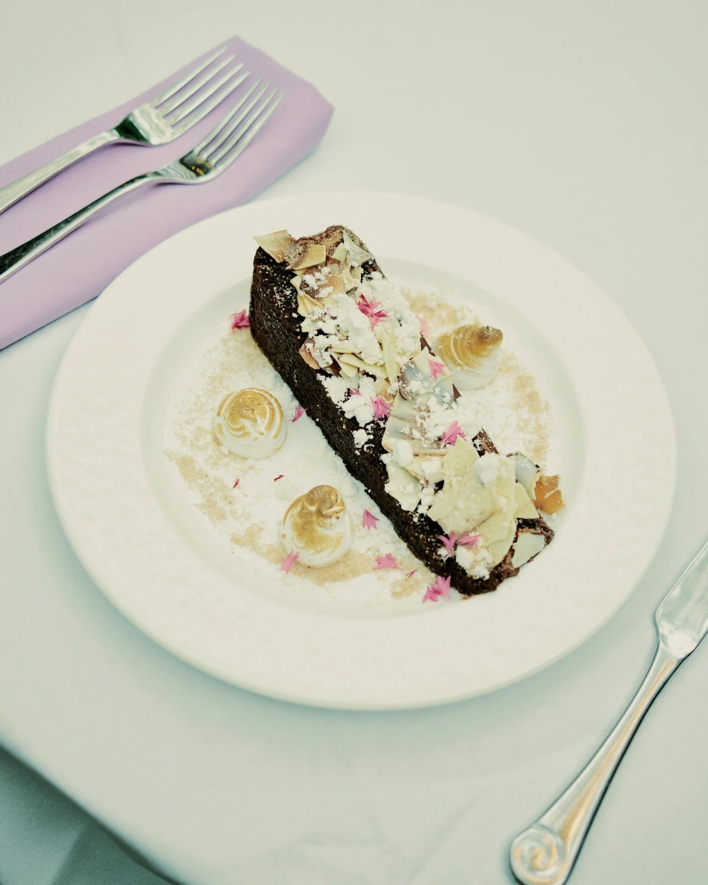 From savory to sweet, everything is crafted from scratch. Our triple chocolate cake layers house made chocolate cake, chocolate mousse, ganache, and crumble, finished with brown butter powder and bruleed Italian meringue. Decadent, balanced, and deep