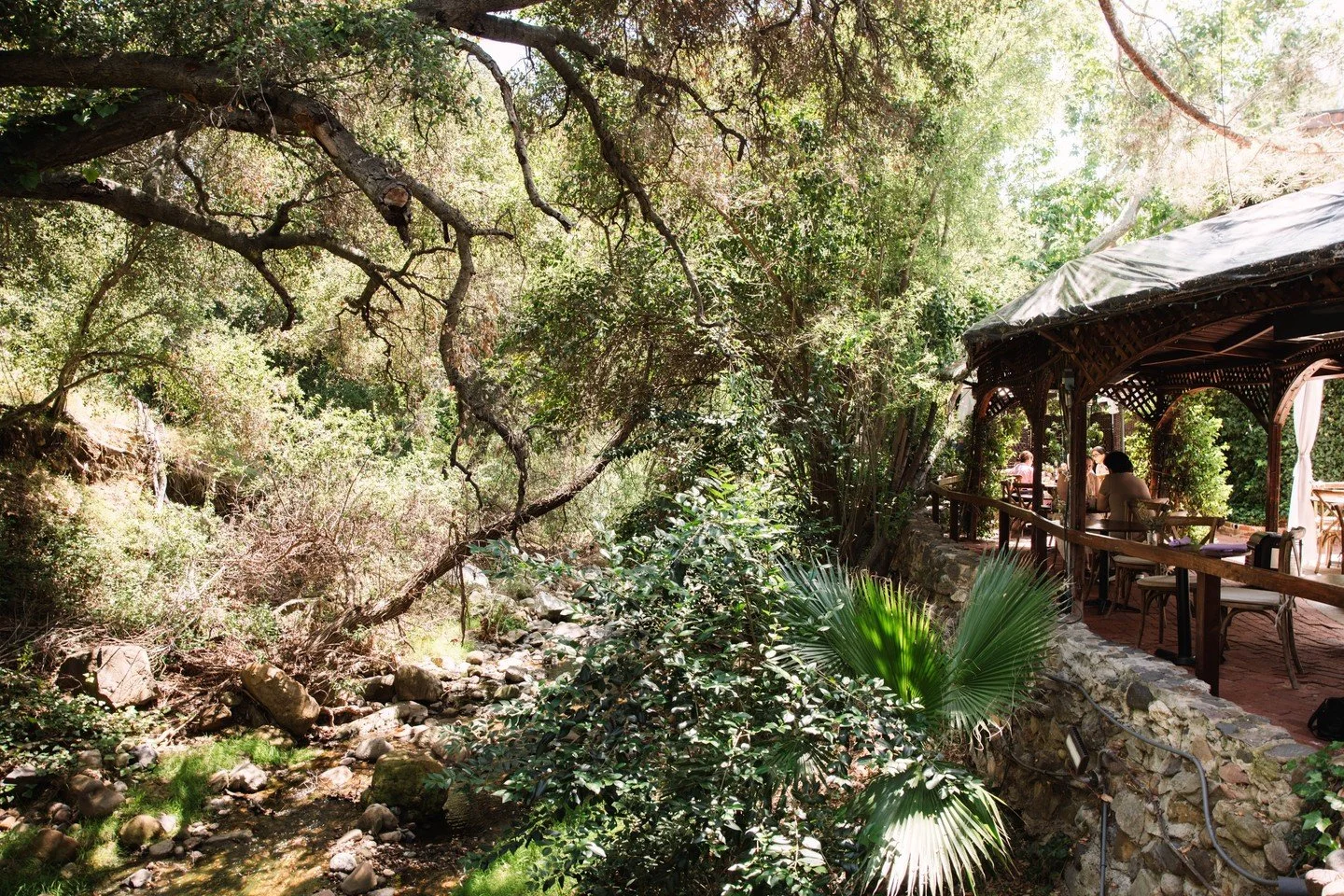 Right next to the creek, under the wood beams and stone, with the sound of water running through it all. It&rsquo;s the kind of place you settle into and don&rsquo;t want to leave.