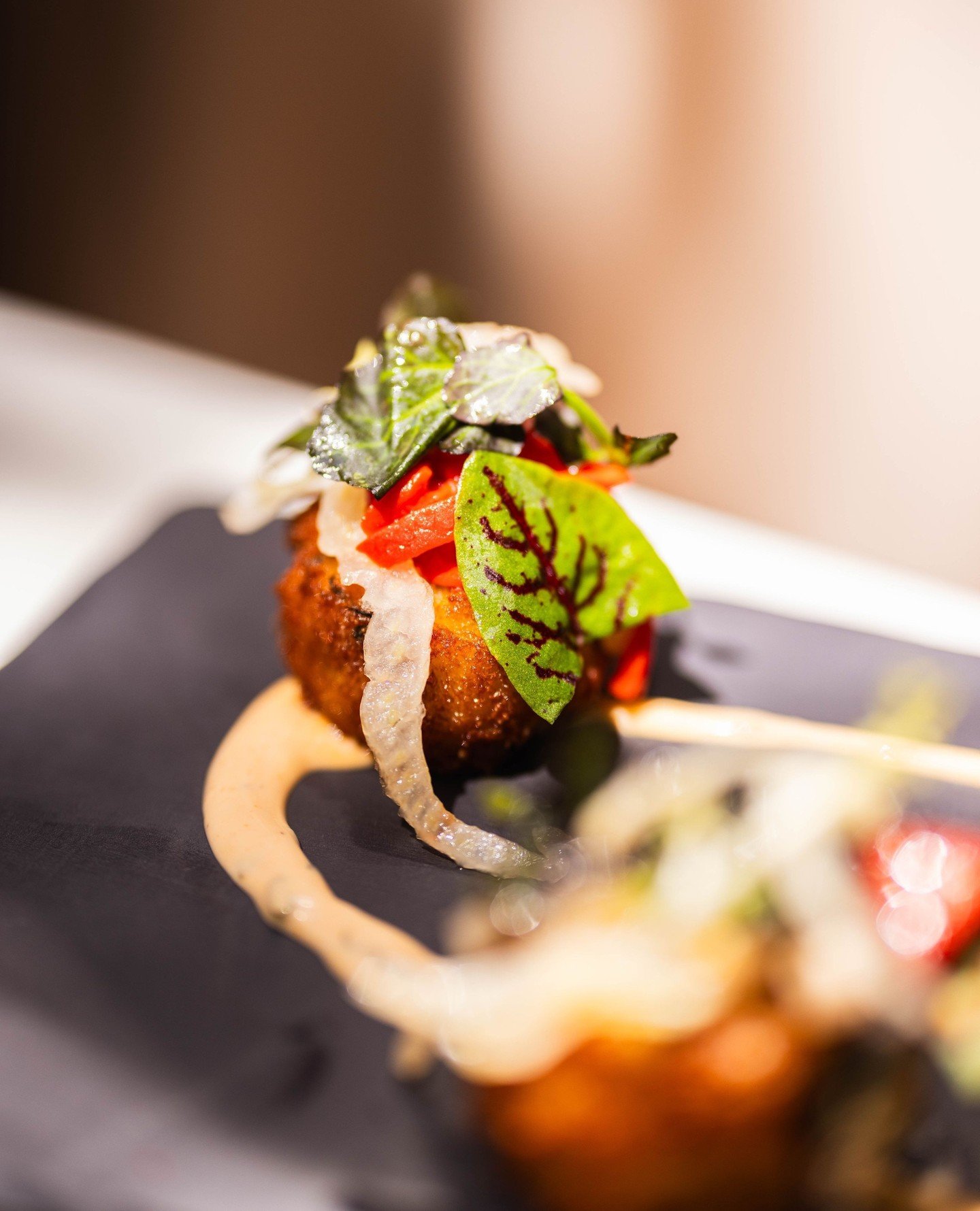 No, not a crab cake, a shrimp cake. And not your typical shrimp cake. These are our crispy shrimp cakes, inspired by the flavors of siu mai. Fresh and fermented shrimp bring depth and texture, finished with a California coastal twist of shaved fennel