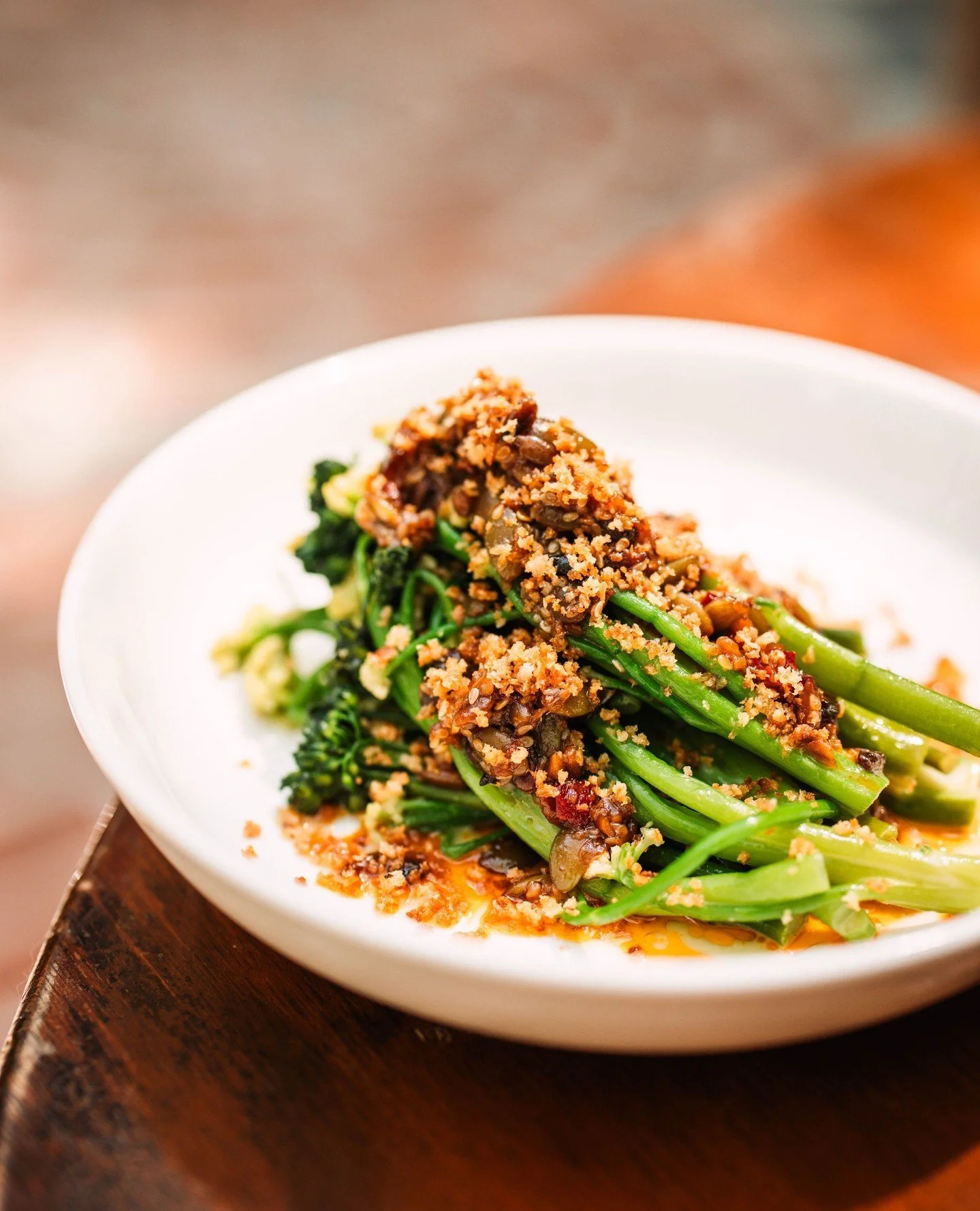 Vegetables are never an afterthought here. They begin at the market, chosen with care, and treated with the respect they deserve. Sprouting cauliflower &amp; broccolini are gently saut&eacute;ed with confit shallots, then spooned with a warm crispy g