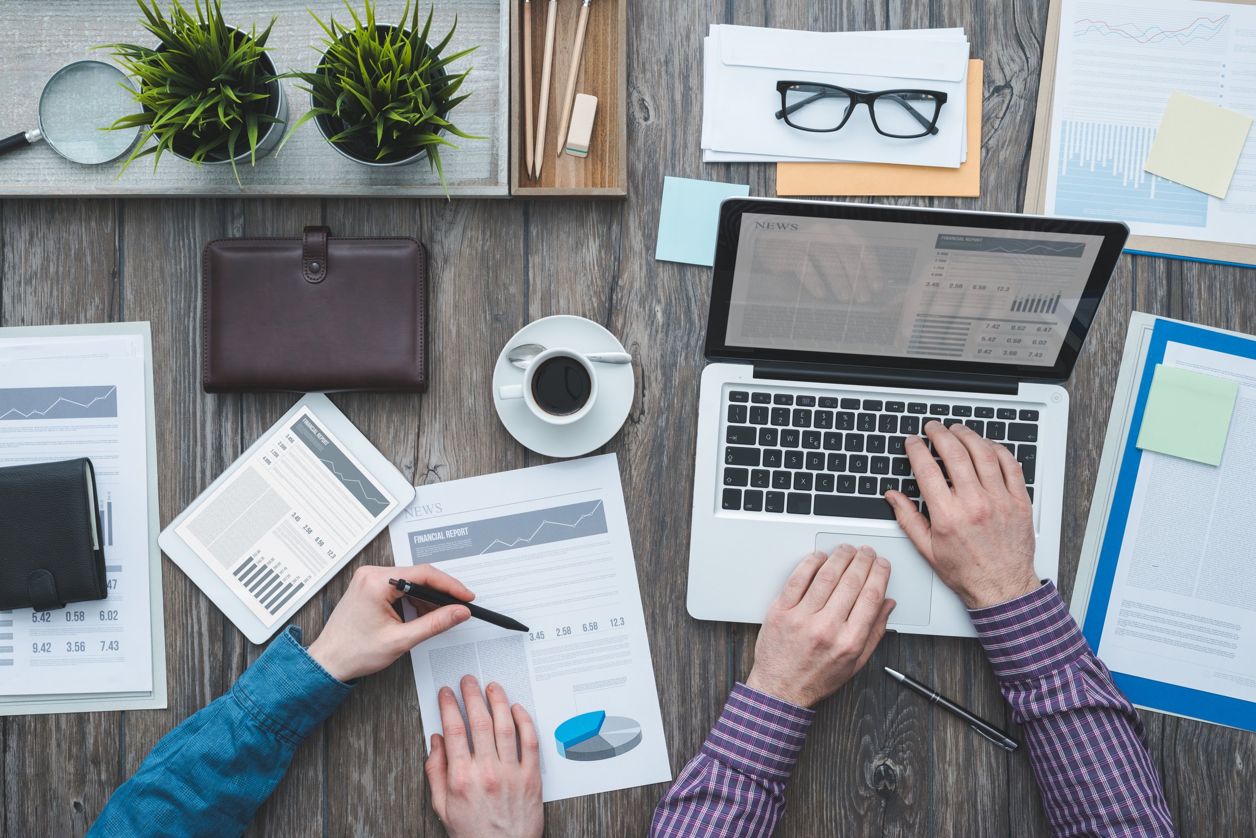 Two people working together at a desk